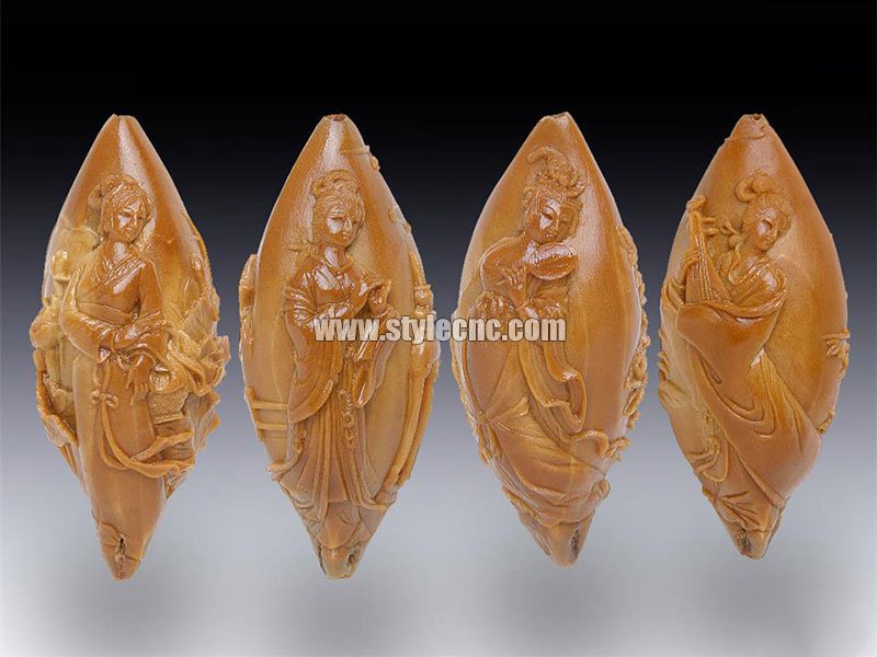 使用數控雕刻機對劣質橄欖核進行雕刻